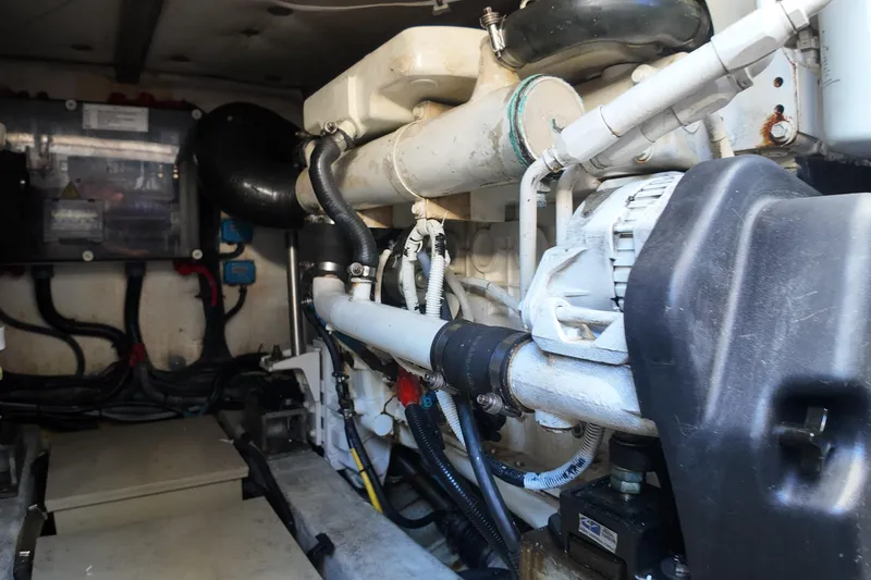 Slide: The Image of Engine compartment of a 2012 Azimut 40 FLY yacht, showcasing mechanical components and wiring. - 43