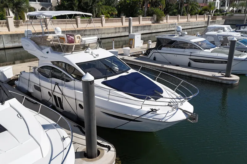 Slide: The Image of Azimut 40 FLY 2012 yacht docked in marina, surrounded by other boats. - 5
