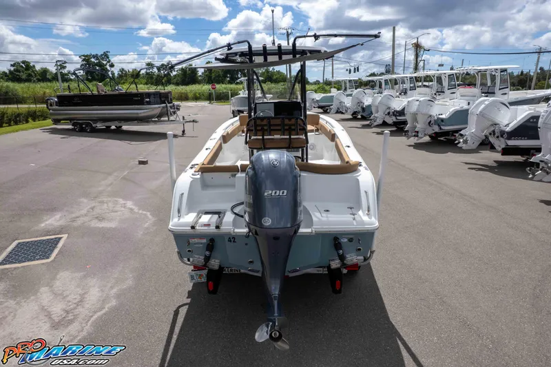 Slide: The Image of 2022 Sea Hunt Ultra 229 boat with Yamaha 200 engine in a dealership lot. - 11