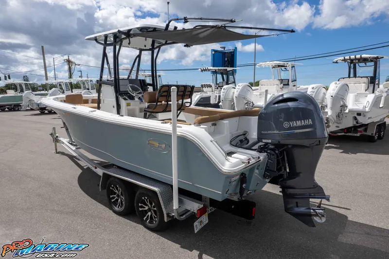 Slide: The Image of 2022 Sea Hunt Ultra 229 boat with Yamaha engine on trailer, outdoor display. - 13