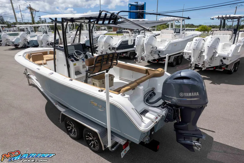 Slide: The Image of 2022 Sea Hunt Ultra 229 boat with Yamaha engine on display at dealership. - 14