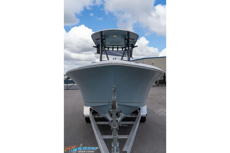 Slide: The Image of 2022 Sea Hunt Ultra 229 boat on trailer under cloudy sky. - 21