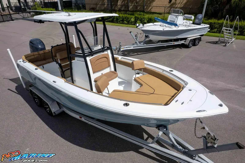 Slide: The Image of 2022 Sea Hunt Ultra 229 boat on trailer, featuring sleek design and spacious seating. - 3