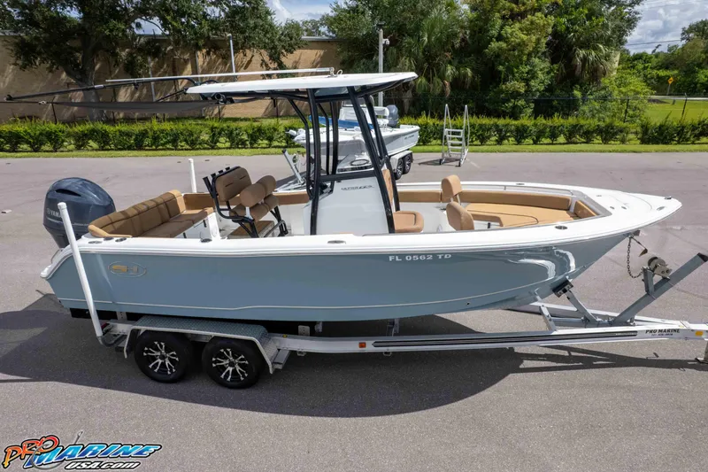 Slide: The Image of 2022 Sea Hunt Ultra 229 boat on trailer, parked outdoors, side view. - 5