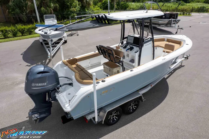 Slide: The Image of 2022 Sea Hunt Ultra 229 boat with Yamaha engine on trailer, parked outdoors. - 9