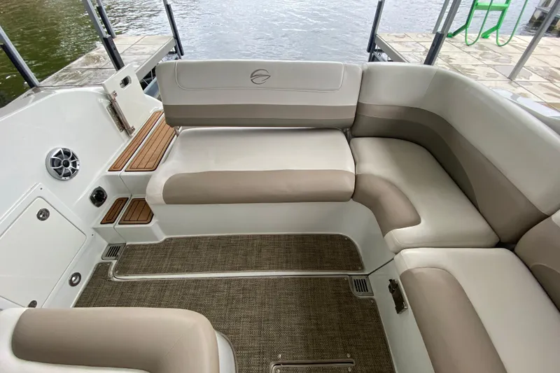 Slide: The Image of Control panel inside a 2015 Crownline 335 SS boat, featuring switches and a red knob. - 14