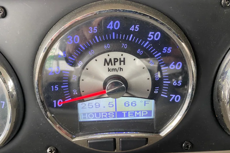 Slide: The Image of Close-up of 2015 Crownline 335 SS boat RPM gauge displaying 256.8 hours on water. - 25