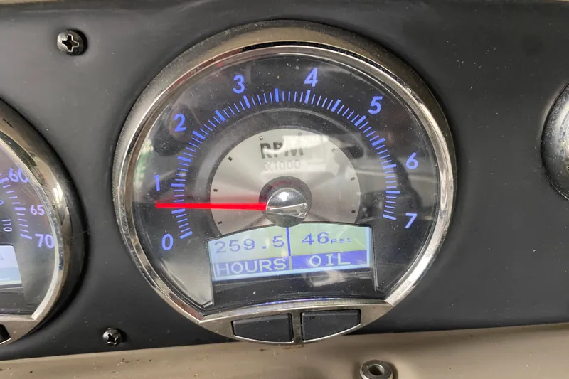 Slide: The Image of 2015 Crownline 335 SS boat dashboard with steering wheel and control panel. - 27