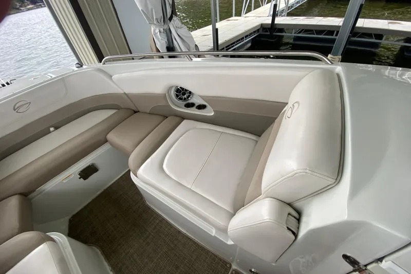 Slide: The Image of Storage compartment with life jackets on a 2015 Crownline 335 SS boat. - 36