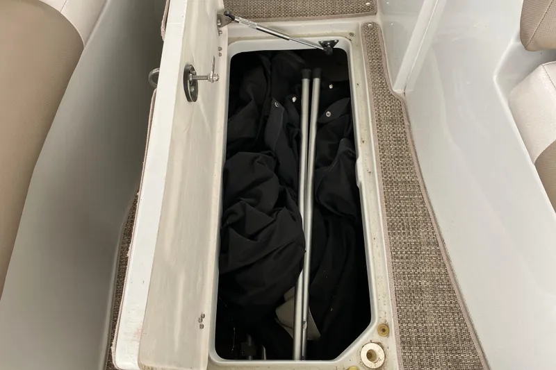 Slide: The Image of 2015 Crownline 335 SS engine compartment with dual engines and wiring. - 45