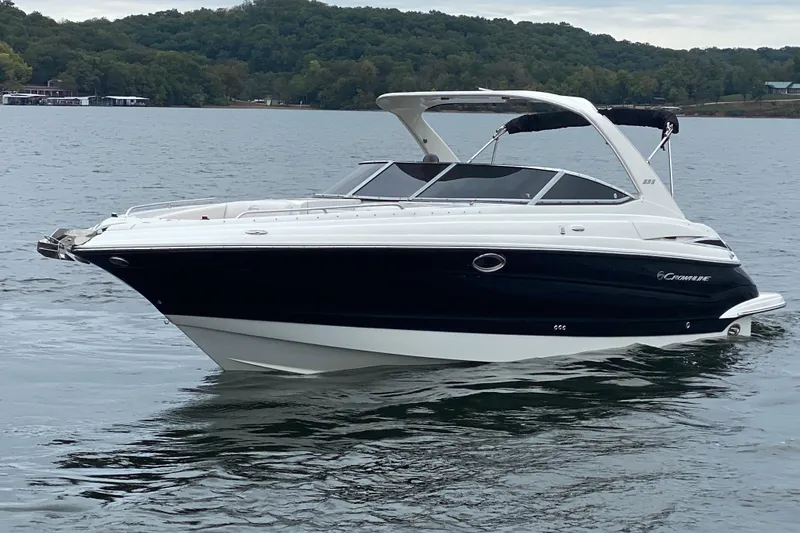 Slide: The Image of 2015 Crownline 335 SS boat covered and docked in a sheltered marina. - 5