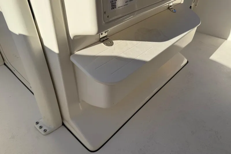Slide: The Image of 2026 Key West 239 FSR boat interior with storage drawers and K2 cooler. - 10