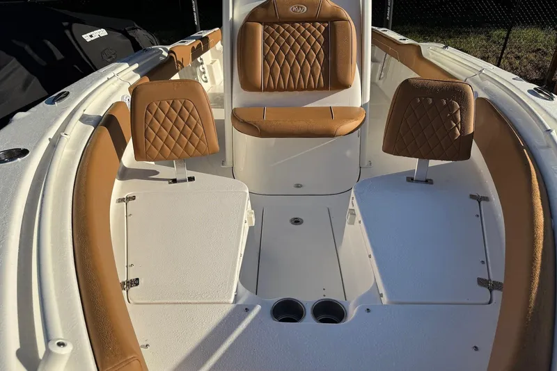 Slide: The Image of 2026 Key West 239 FSR boat seating with integrated rod holders and cup holders. - 13