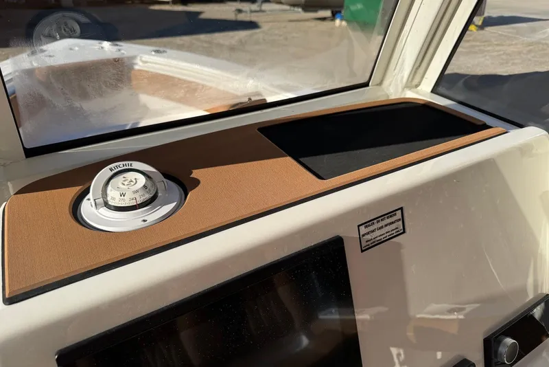 Slide: The Image of Manufacturer Provided Image: 2025 Key West 239 FSR boat on calm water at sunset. - 15