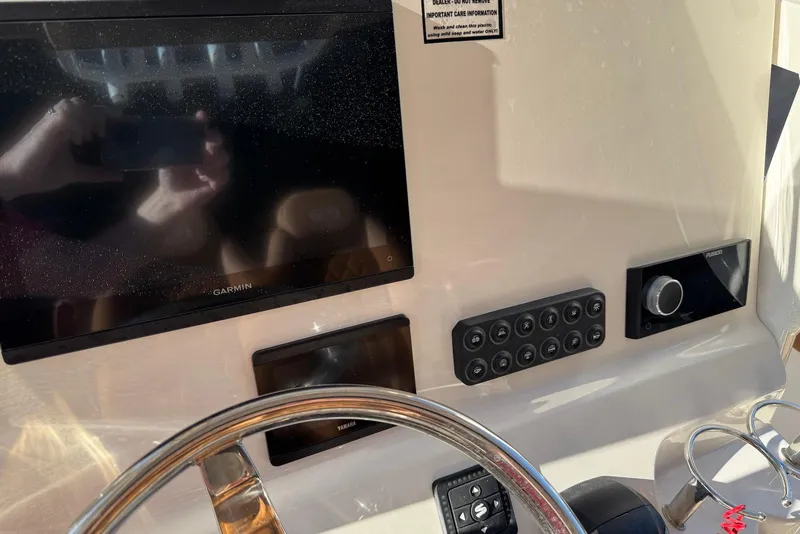 Slide: The Image of Manufacturer Provided Image: 2025 Key West 239 FSR boat on calm water at sunset. - 16