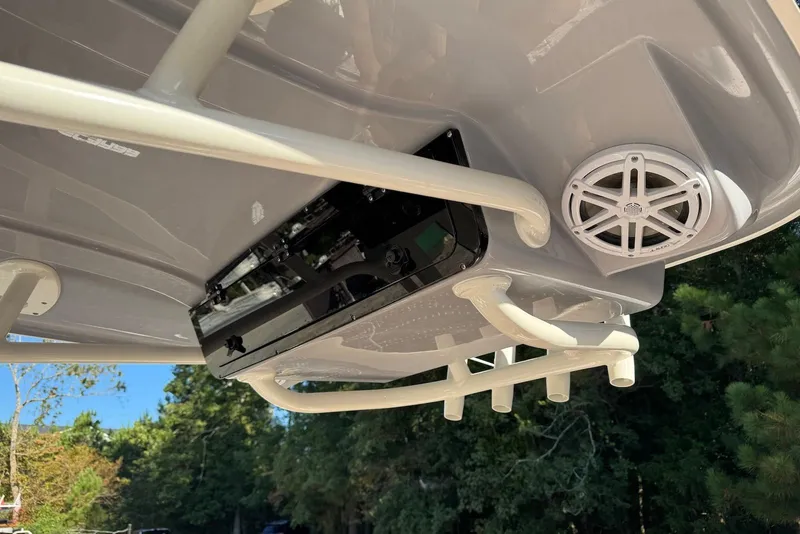 Slide: The Image of 2026 Key West 239 FSR boat T-top with speakers, clear sky background. - 9