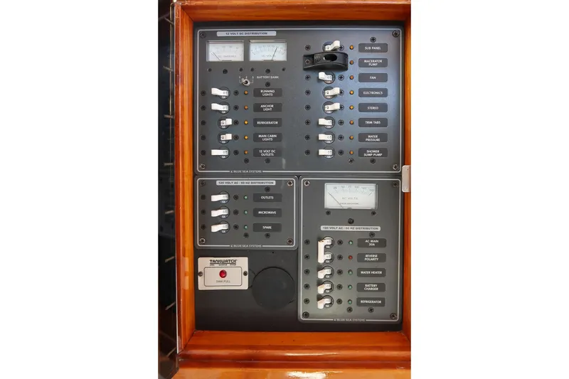 Slide: The Image of Electrical control panel on 2005 Hunt Yachts Surfhunter 29, featuring various switches and gauges. - 25