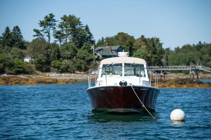 Slide: The Image of 2005 Hunt Yachts Surfhunter 29 anchored in scenic coastal waters. - 28