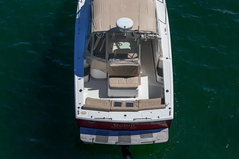 Slide: The Image of 2005 Hunt Yachts Surfhunter 29 boat, aerial view, on green water. - 7