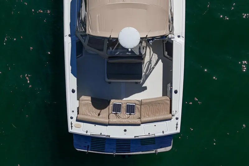Slide: The Image of Aerial view of 2005 Hunt Yachts Surfhunter 29 on water, showcasing deck and seating. - 8