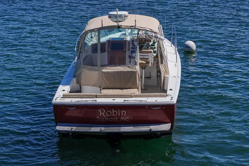 Slide: The Image of 2005 Hunt Yachts Surfhunter 29 boat on water, rear view, named "Robin" from Tremont, ME. - 9