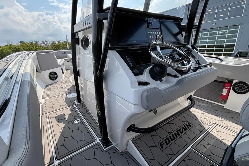 Slide: The Image of 2022 Fountain 38 SC boat interior with modern dashboard and sleek design. - 18