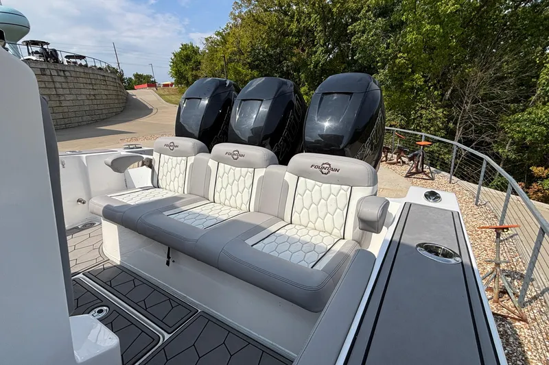 Slide: The Image of 2022 Fountain 38 SC boat with triple outboard engines and luxurious seating. - 21
