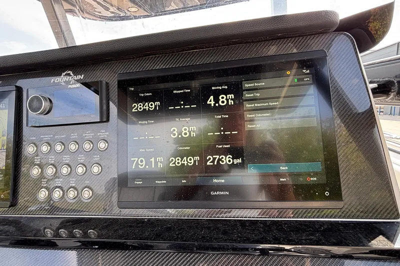 Slide: The Image of Dashboard of 2022 Fountain 38 SC boat with Garmin display showing trip data. - 24