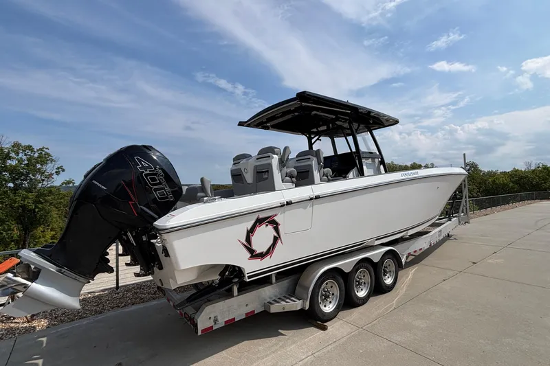 Slide: The Image of 2022 Fountain 38 SC boat on trailer with powerful outboard engine. - 4