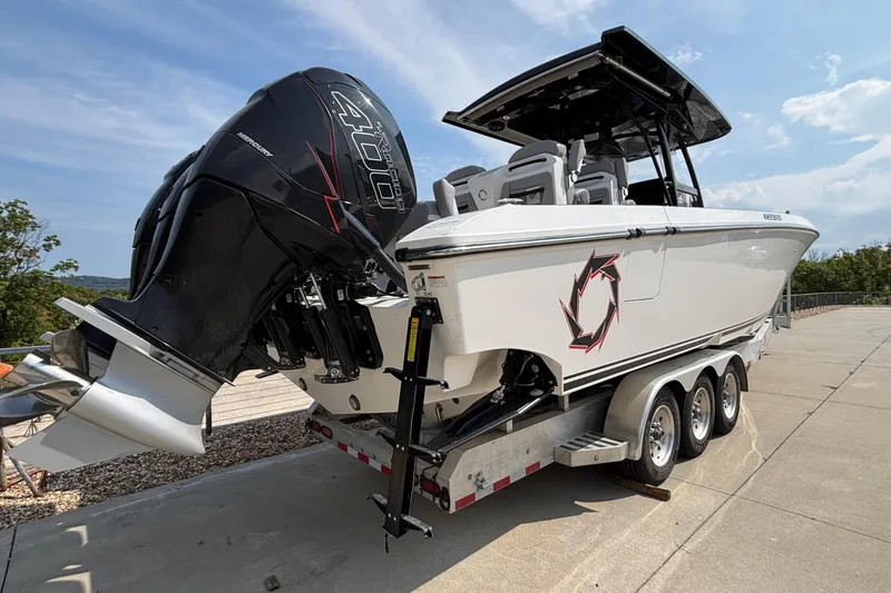 Slide: The Image of 2022 Fountain 38 SC boat on trailer with powerful outboard engine. - 8