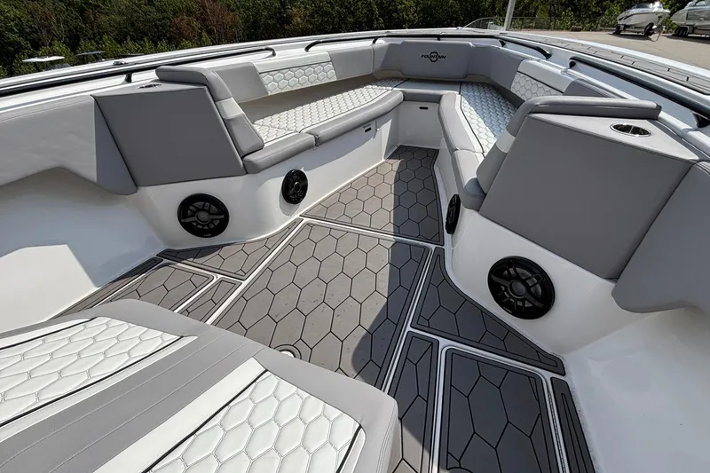 Slide: The Image of Luxurious interior of 2022 Fountain 38 SC boat with stylish seating and speakers. - 9