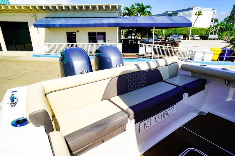 Slide: The Image of 2021 Tidewater 256 LXF boat with dual 150 engines and comfortable seating. - 5
