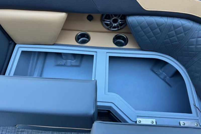 Slide: The Image of Interior storage compartment of 2026 Godfrey SWEETWATER 2286 SFL boat with cup holders. - 10