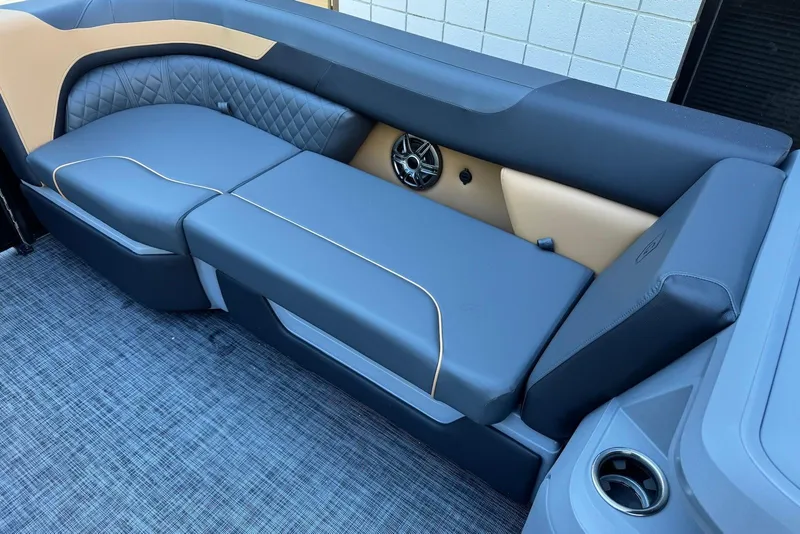 Slide: The Image of 2026 Godfrey SWEETWATER 2286 SFL boat interior with luxurious seating and speaker system. - 11
