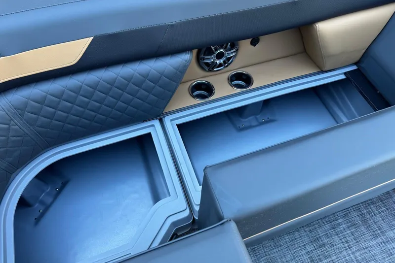 Slide: The Image of Interior storage compartments of 2026 Godfrey SWEETWATER 2286 SFL boat with quilted upholstery. - 12