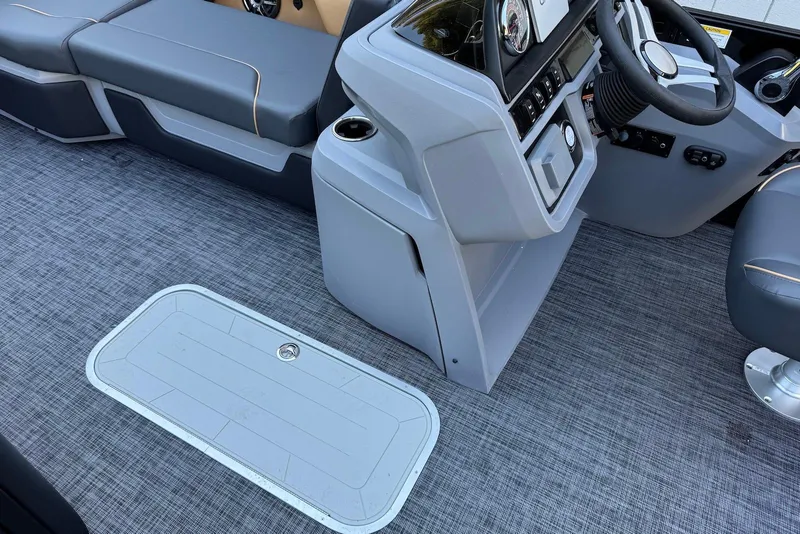 Slide: The Image of Interior of 2026 Godfrey SWEETWATER 2286 SFL boat with modern seating and control panel. - 13