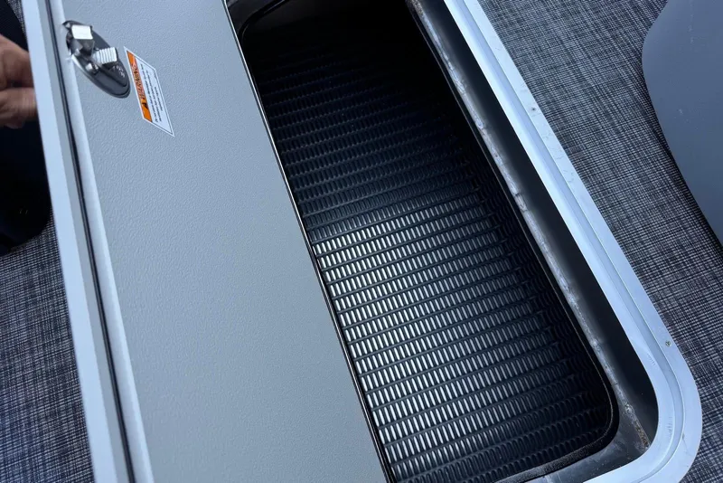 Slide: The Image of Open storage compartment on 2026 Godfrey SWEETWATER 2286 SFL boat, featuring textured interior. - 15
