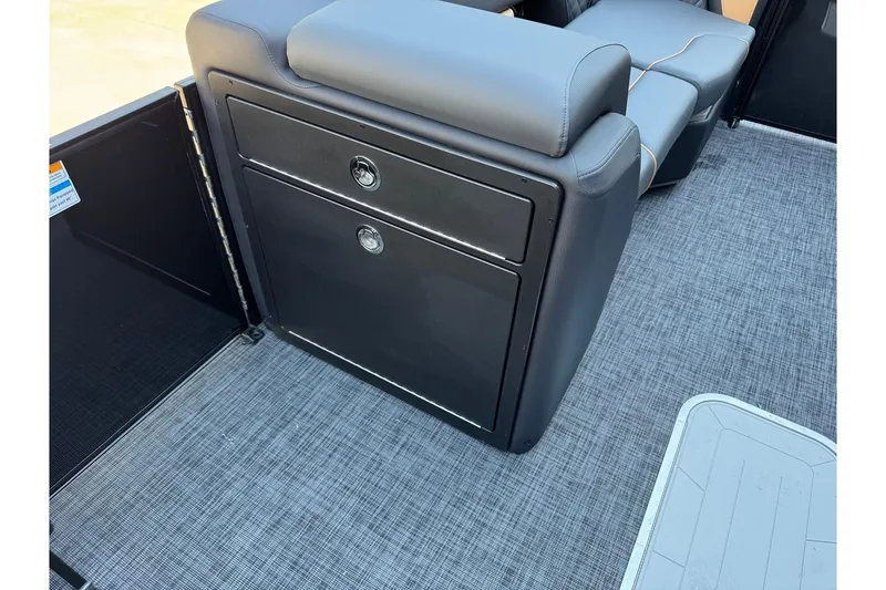 Slide: The Image of 2026 Godfrey SWEETWATER 2286 SFL boat interior with sleek seating and storage. - 16