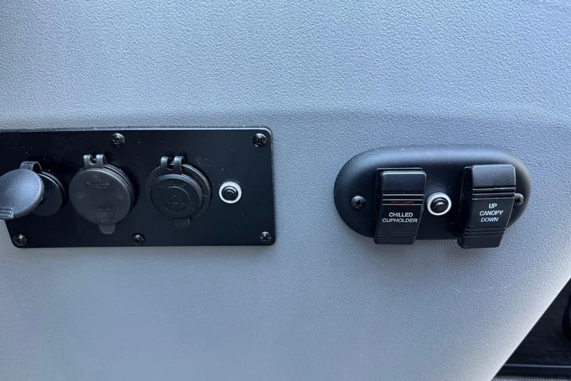 Slide: The Image of Control panel on 2026 Godfrey SWEETWATER 2286 SFL with switches and outlets. - 24