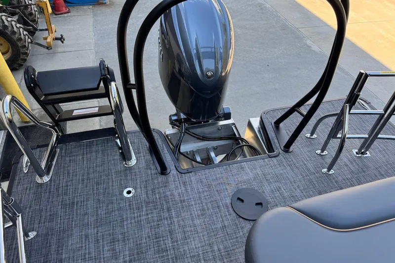 Slide: The Image of 2026 Godfrey SWEETWATER 2286 SFL boat deck with motor and seating area. - 35