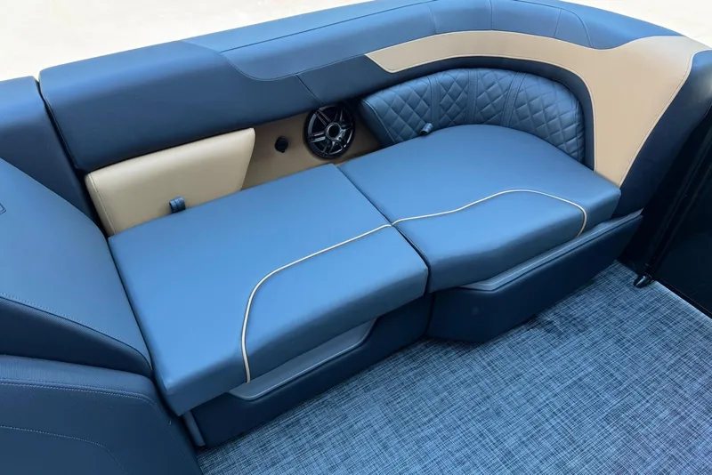 Slide: The Image of Luxurious seating on 2026 Godfrey SWEETWATER 2286 SFL boat, featuring blue and tan upholstery. - 9