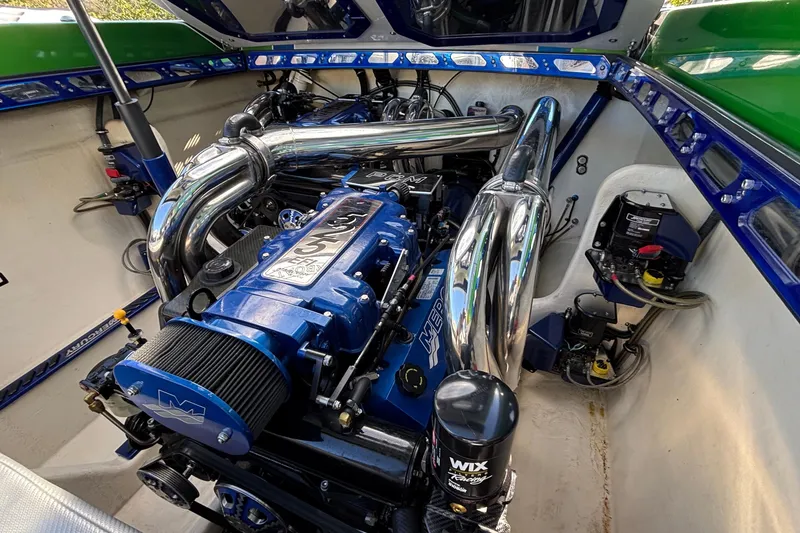Slide: The Image of Engine compartment of 2013 Sunsation 36 XRT boat with polished components. - 12