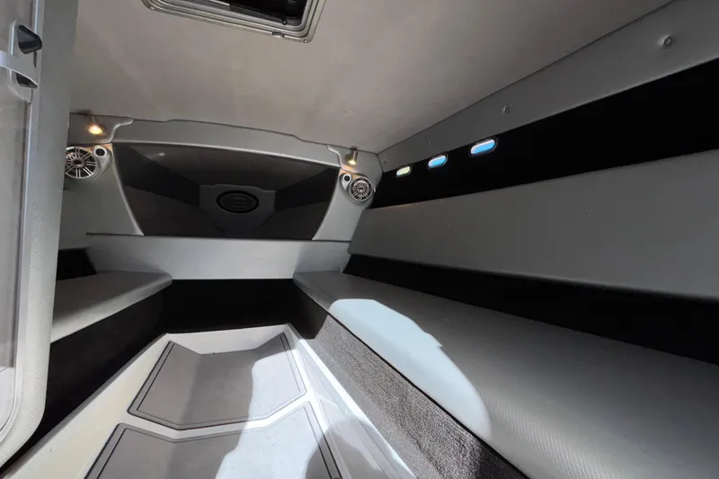 Slide: The Image of Interior cabin of 2013 Sunsation 36 XRT boat, featuring sleek seating and modern design. - 19
