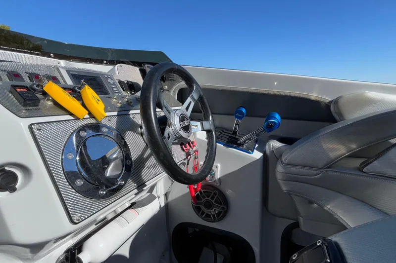 Slide: The Image of 2013 Sunsation 36 XRT boat cockpit with steering wheel and control panel. - 23