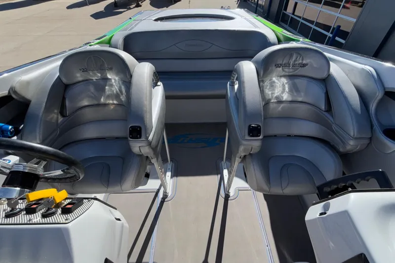 Slide: The Image of Interior of 2013 Sunsation 36 XRT boat with gray leather seats and steering wheel. - 34