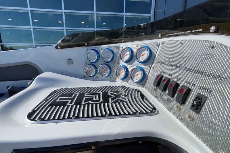 Slide: The Image of Dashboard of 2013 Sunsation 36 XRT boat with gauges and controls. - 36