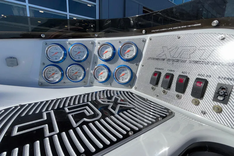 Slide: The Image of Dashboard of 2013 Sunsation 36 XRT boat with gauges and switches. - 37
