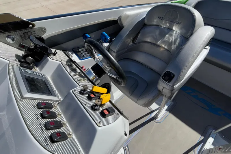 Slide: The Image of 2013 Sunsation 36 XRT boat cockpit with steering wheel and control panel. - 38