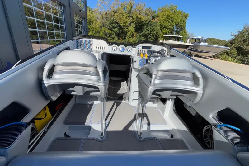 Slide: The Image of 2013 Sunsation 36 XRT boat interior with dual seats and control panel. - 44