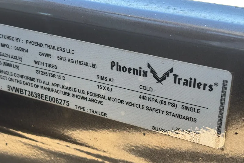 Slide: The Image of Label on Phoenix Trailer for Sunsation 36 XRT, 2013 model, showing specifications and safety standards. - 46
